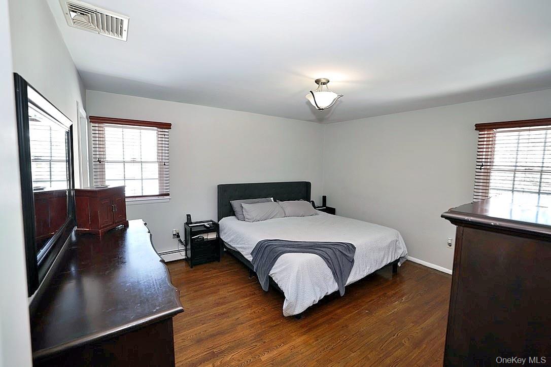28 Jacobs Road Thiells, NY 10984 - Photo 15 of 29 a bedroom with a bed window and wooden floor