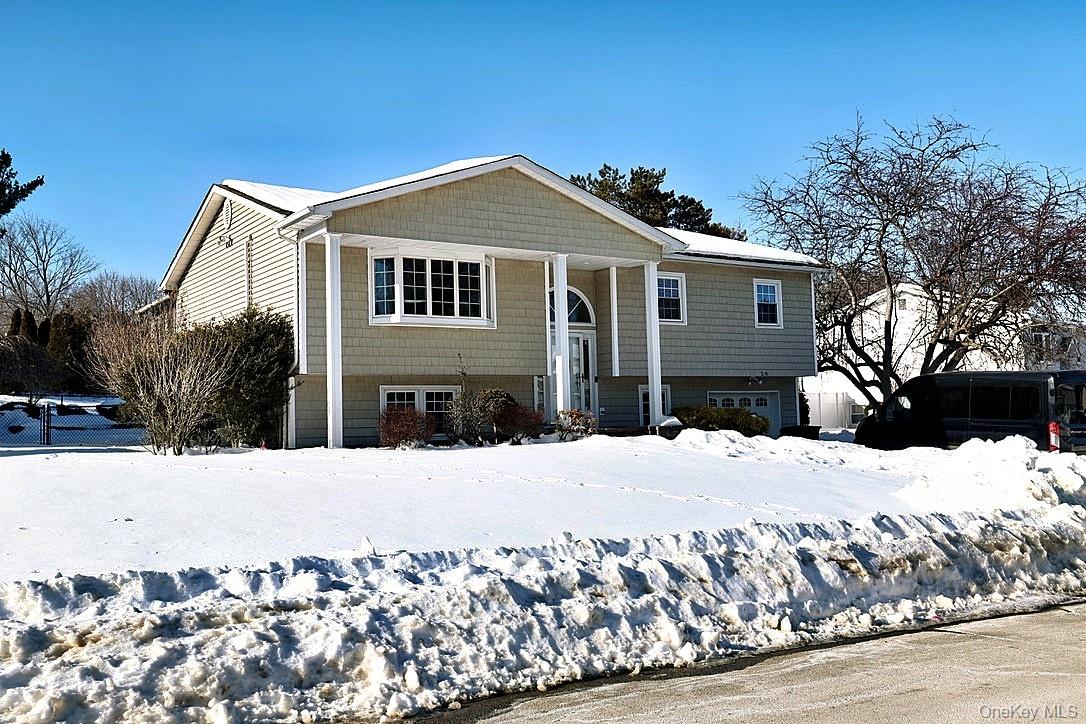 28 Jacobs Road Thiells, NY 10984 - Photo 2 of 29 a front view of a house with a yard covered in snow