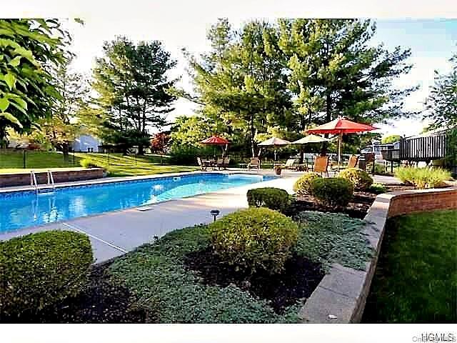 28 Jacobs Road Thiells, NY 10984 - Photo 26 of 29 a view of a swimming pool with lawn chairs and plants