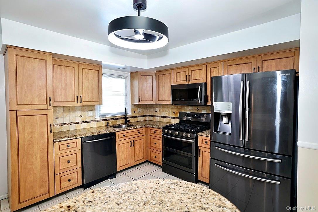 28 Jacobs Road Thiells, NY 10984 - Photo 5 of 29 a kitchen with stainless steel appliances granite countertop a stove refrigerator and microwave