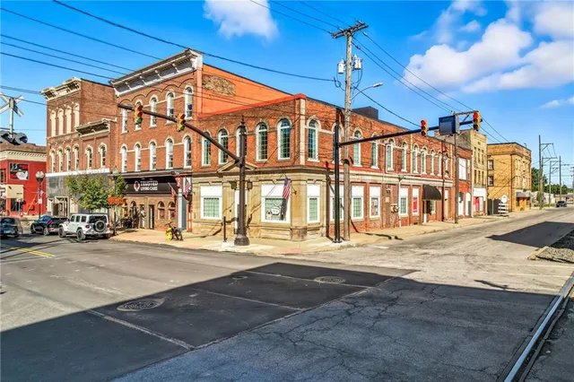 a front view of a building and a umbrellas