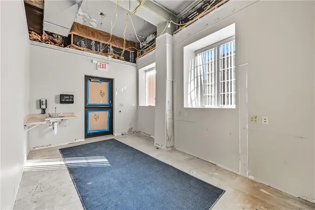 a bathroom with a mirror and a shower