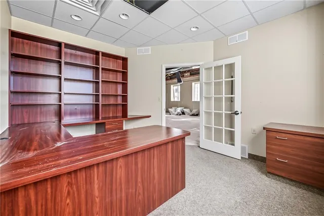 a bathroom with a sink a toilet and shower curtain