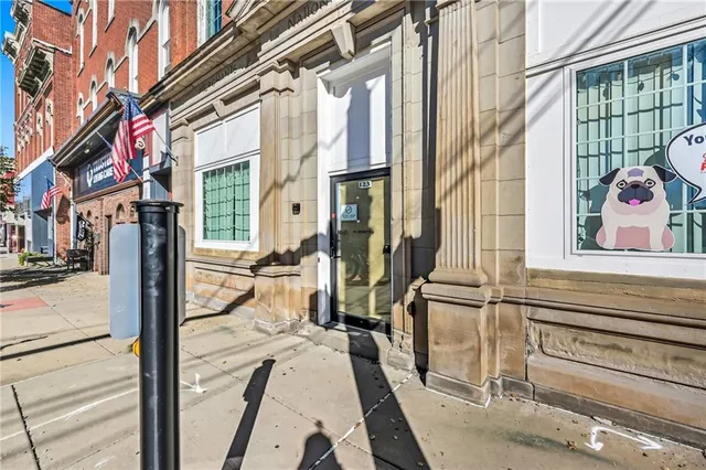 a view of a brick building with many windows