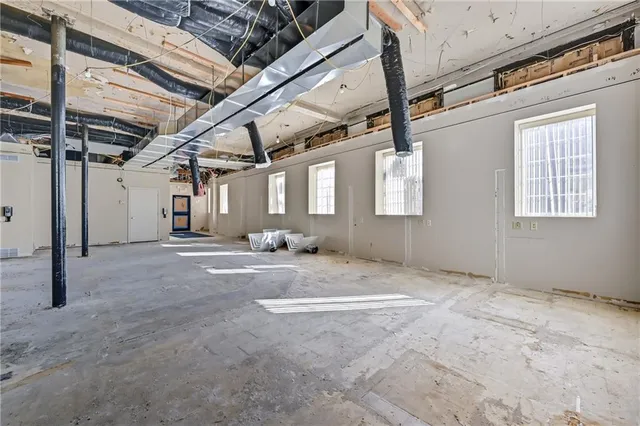 a view of a room with wooden walls