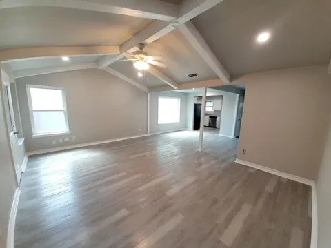 a kitchen with stainless steel appliances a refrigerator a sink a stove a microwave and island