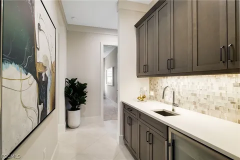 a kitchen with a sink and cabinets