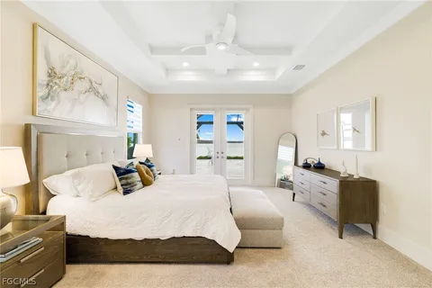 a bedroom with a large bed couch and dresser