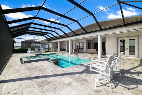a view of a backyard with sitting area