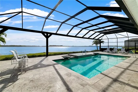 a view of swimming pool with a patio
