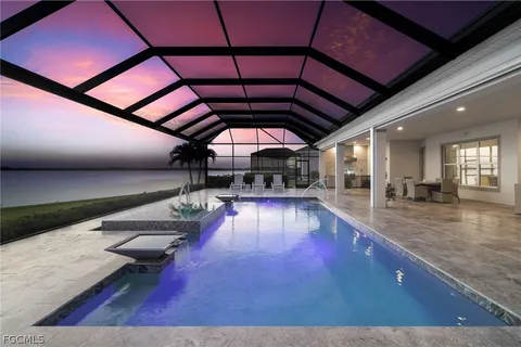 a view of a swimming pool with a patio