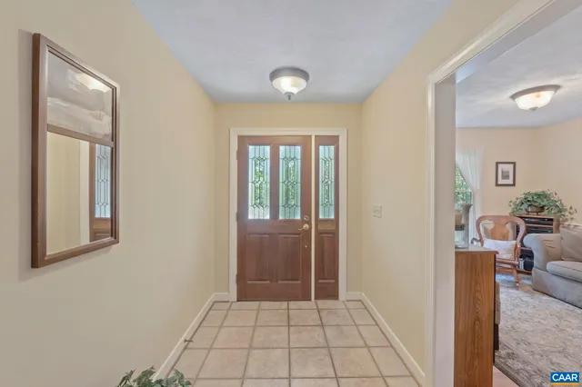 a view of a livingroom with an empty space and a window