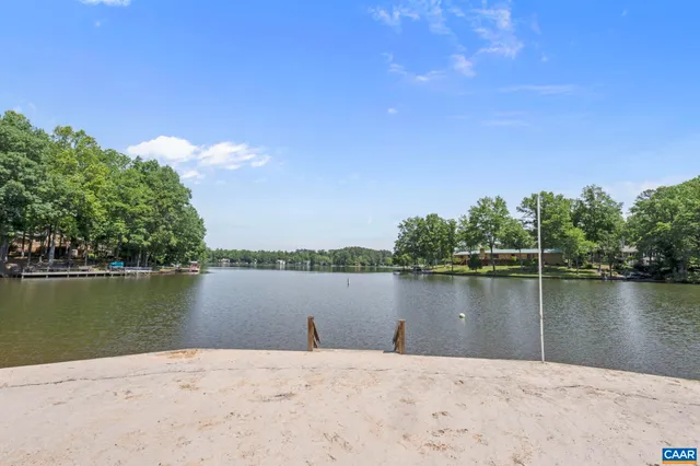 a view of a lake next to a lake with a city view