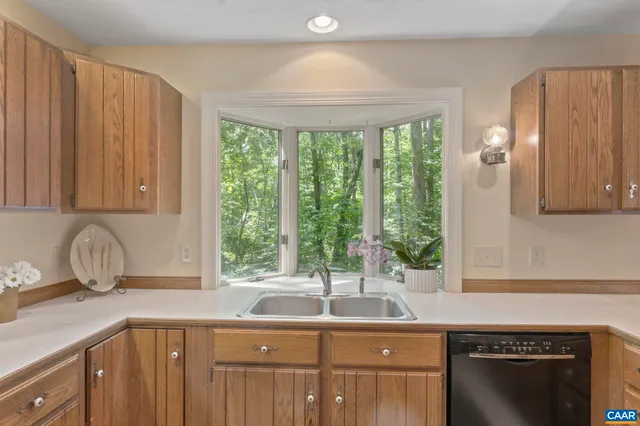 a kitchen with a sink and a window