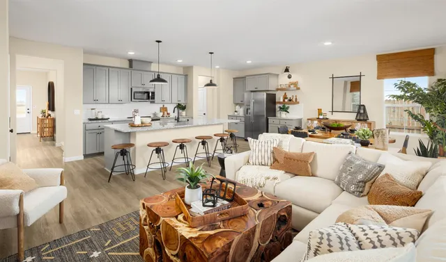 a living room with furniture and flowers