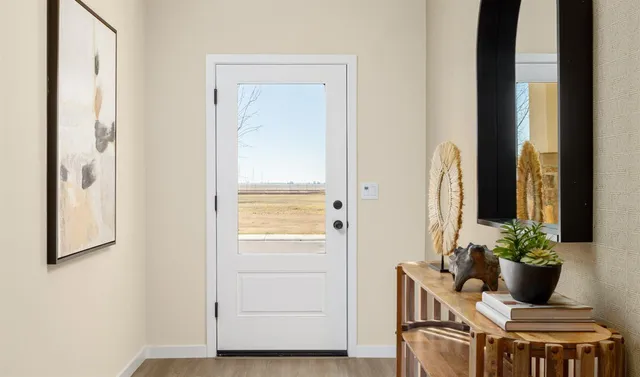 a bedroom with a bed and a potted plant