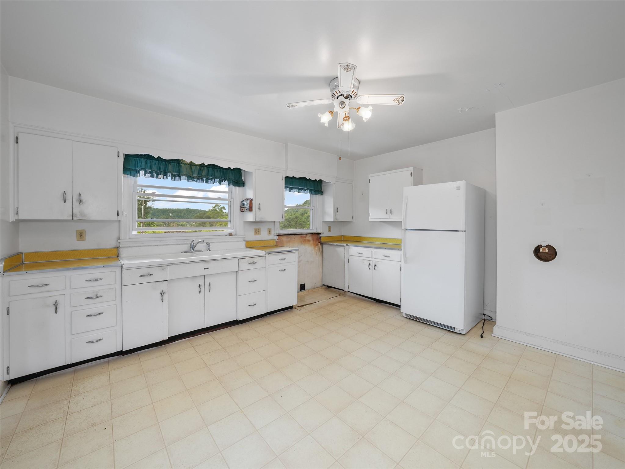 5 Noland Downs Road Waynesville, NC 28785 - Photo 11 of 33 a view of a kitchen with cabinets and wooden floor