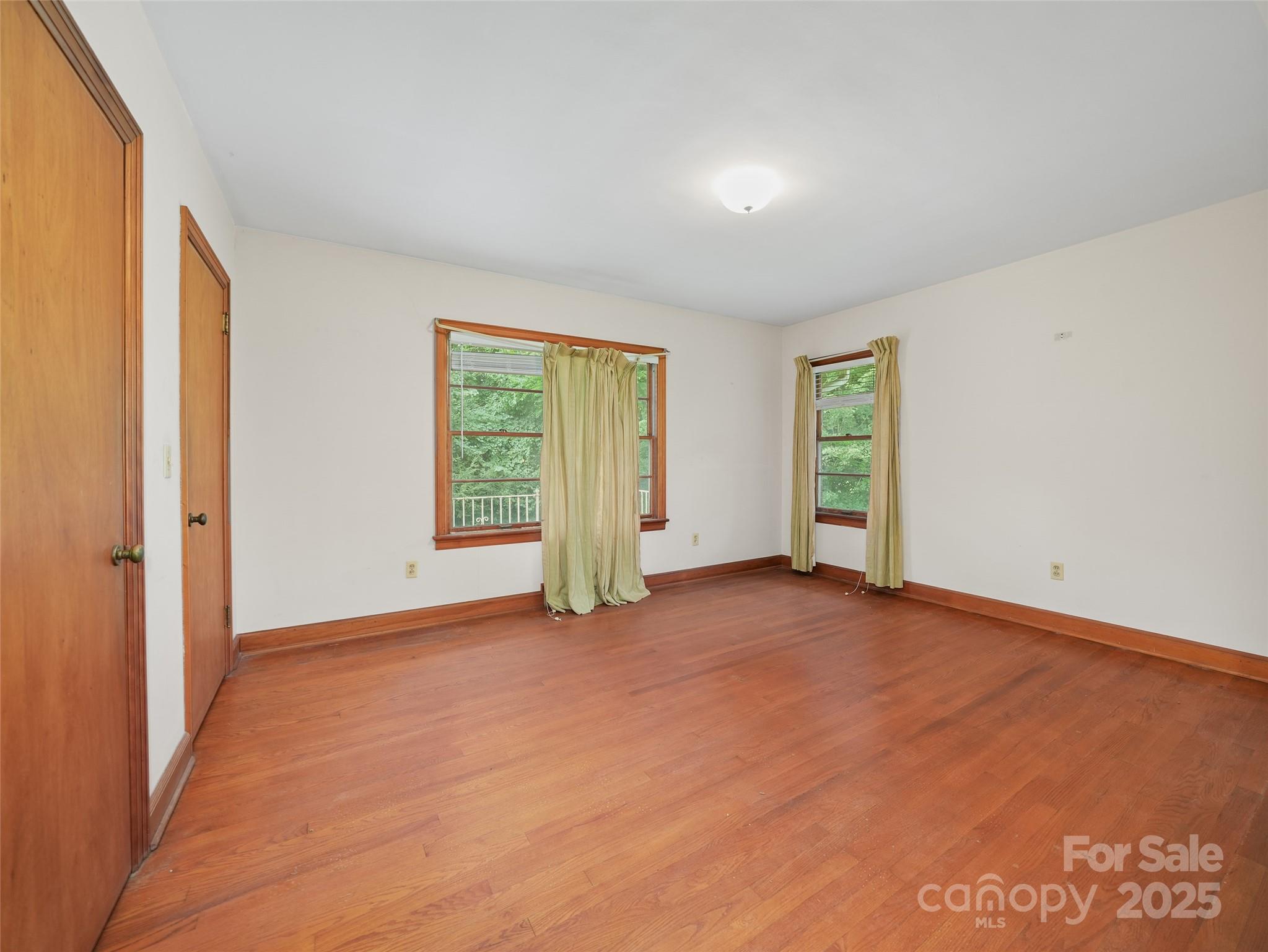 5 Noland Downs Road Waynesville, NC 28785 - Photo 18 of 33 an empty room with windows and closet