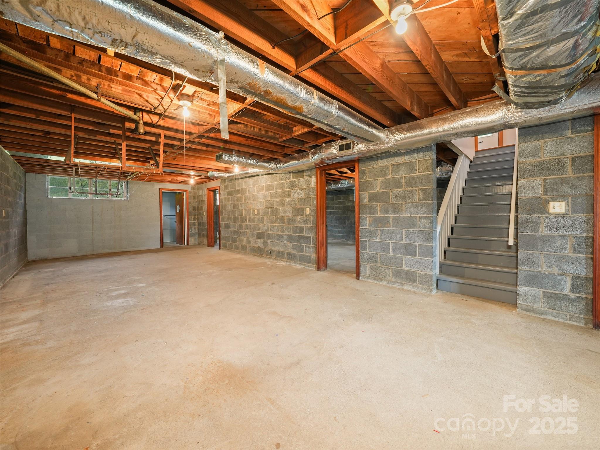 5 Noland Downs Road Waynesville, NC 28785 - Photo 20 of 33 a view of empty room with wooden walls