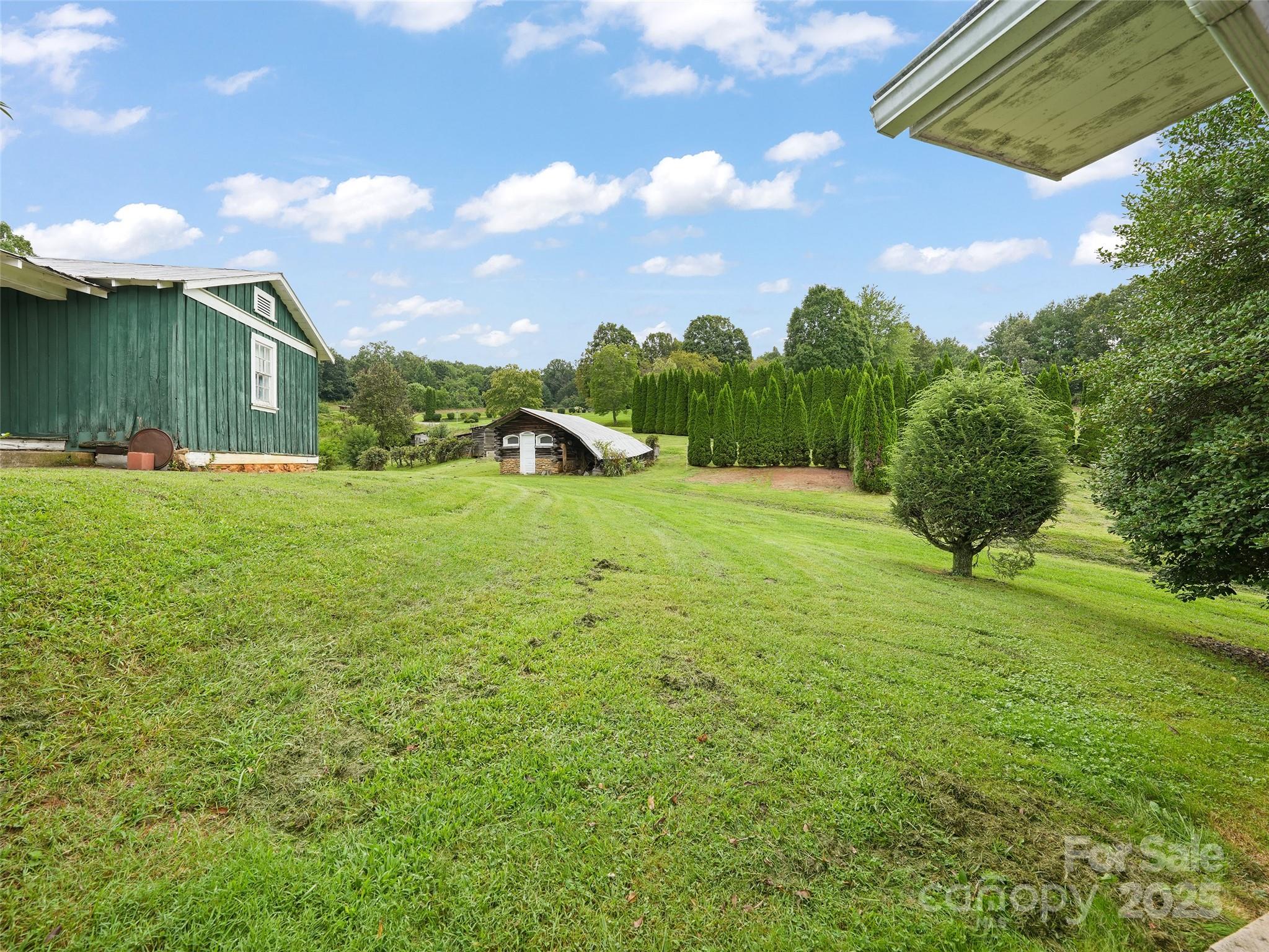 5 Noland Downs Road Waynesville, NC 28785 - Photo 22 of 33 a view of a big yard with a house