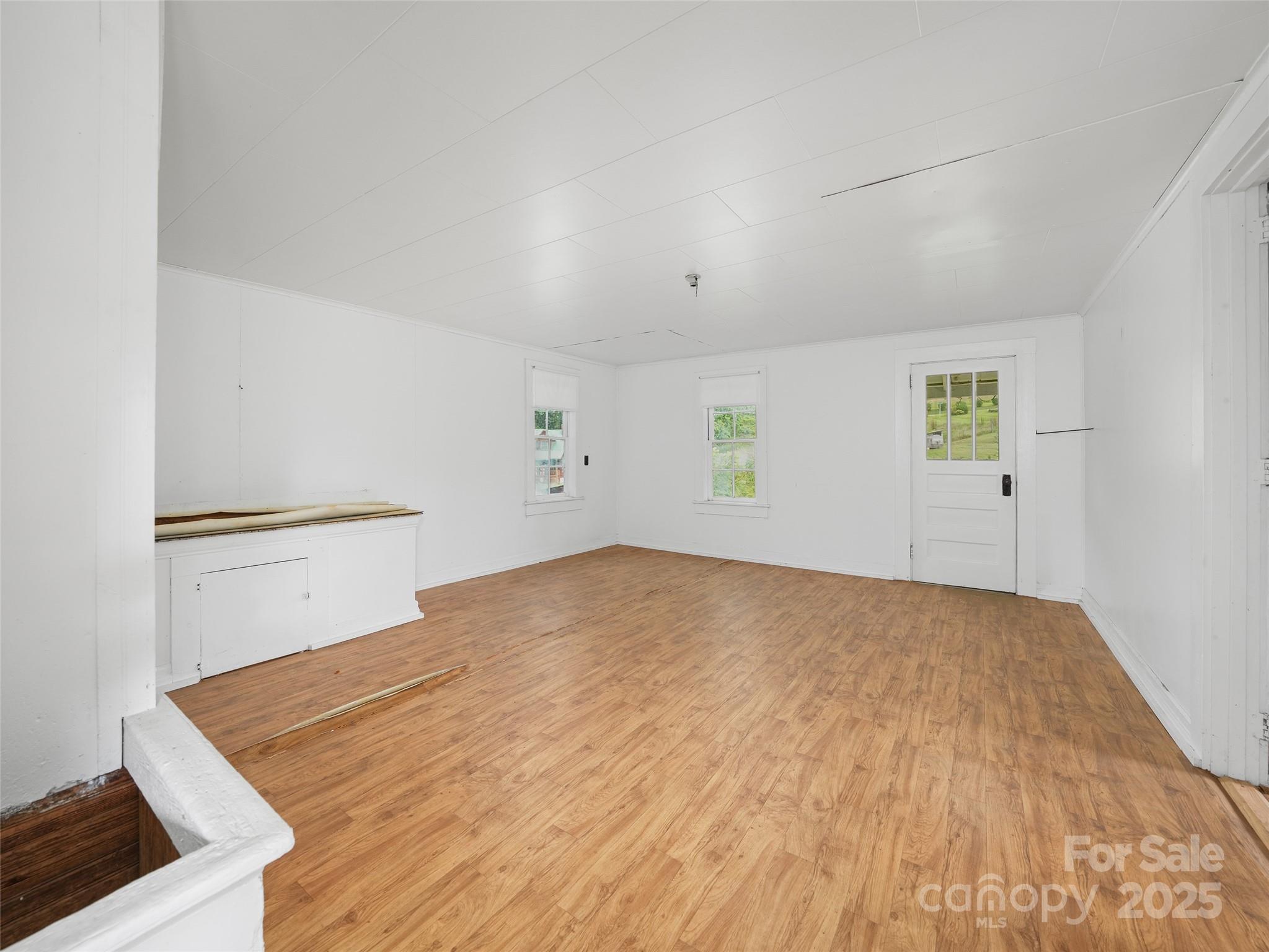 5 Noland Downs Road Waynesville, NC 28785 - Photo 25 of 33 a view of empty room with wooden floor