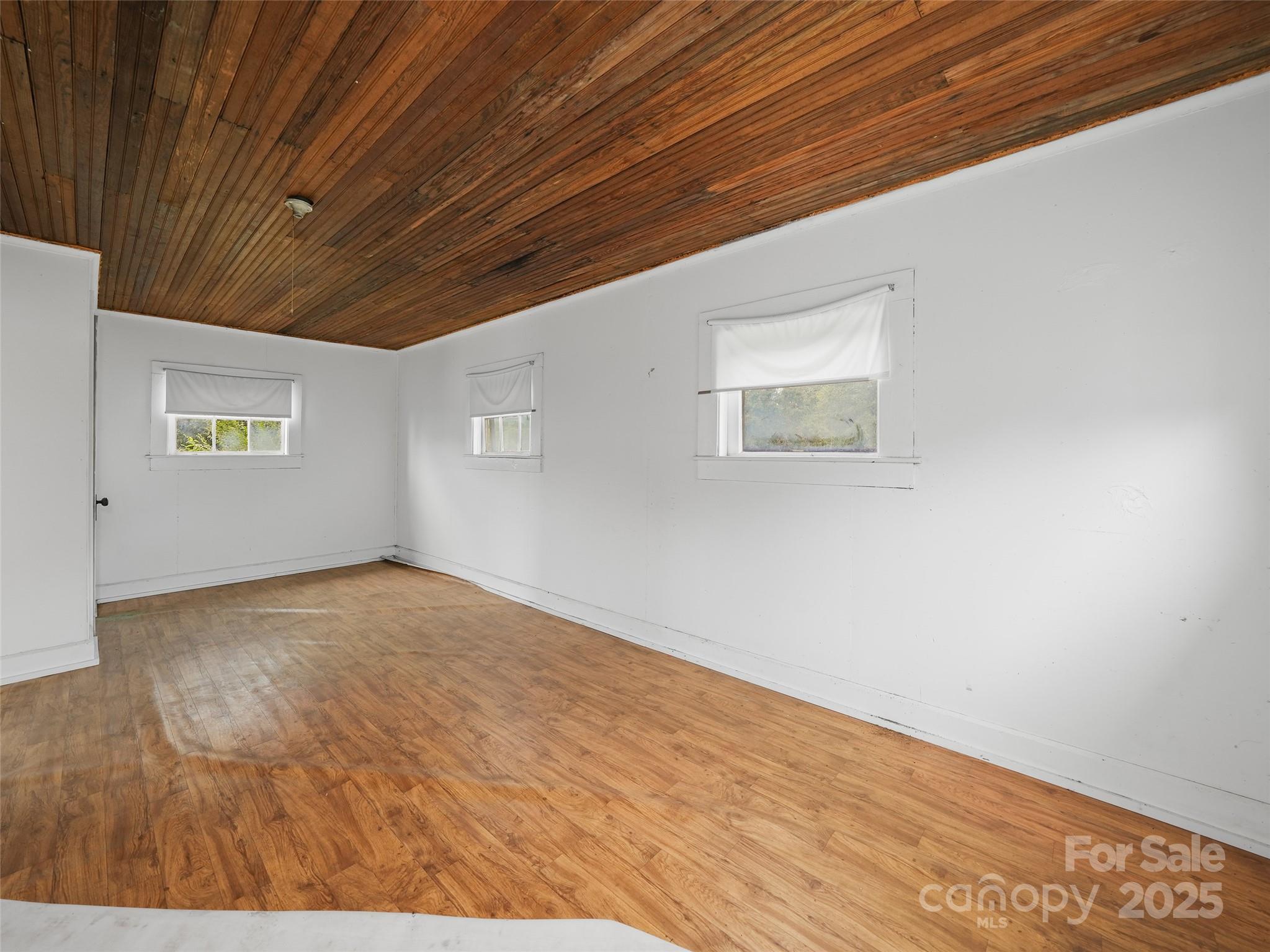 5 Noland Downs Road Waynesville, NC 28785 - Photo 27 of 33 a view of empty room with wooden floor