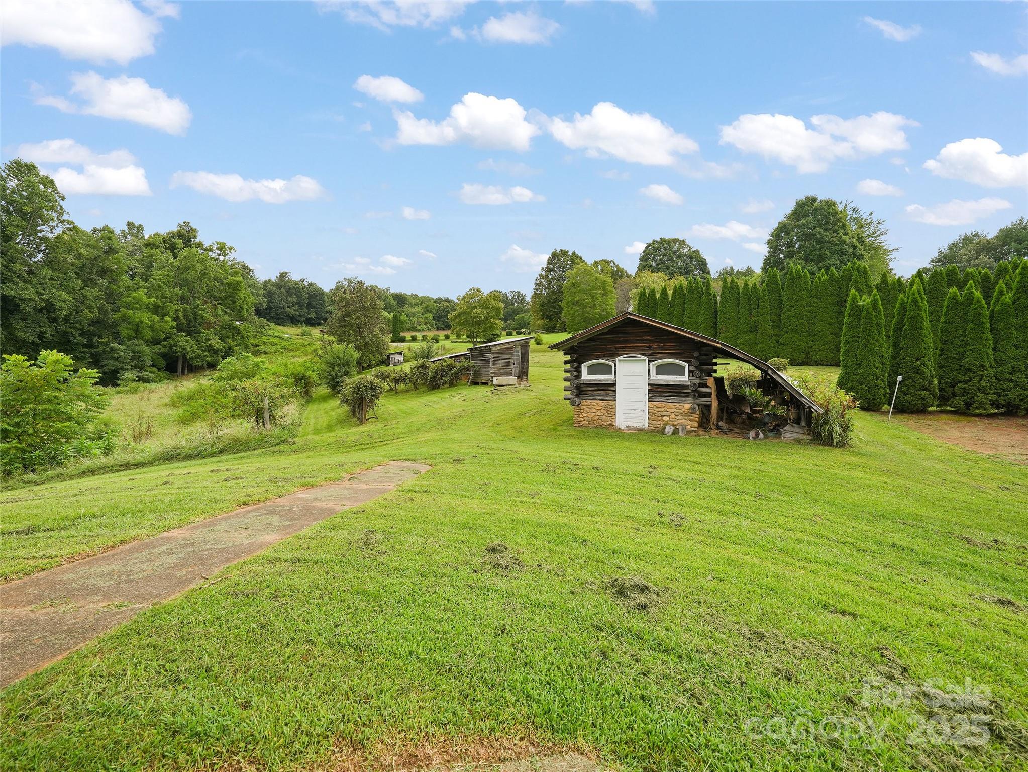 5 Noland Downs Road Waynesville, NC 28785 - Photo 28 of 33 a view of a house with a big yard