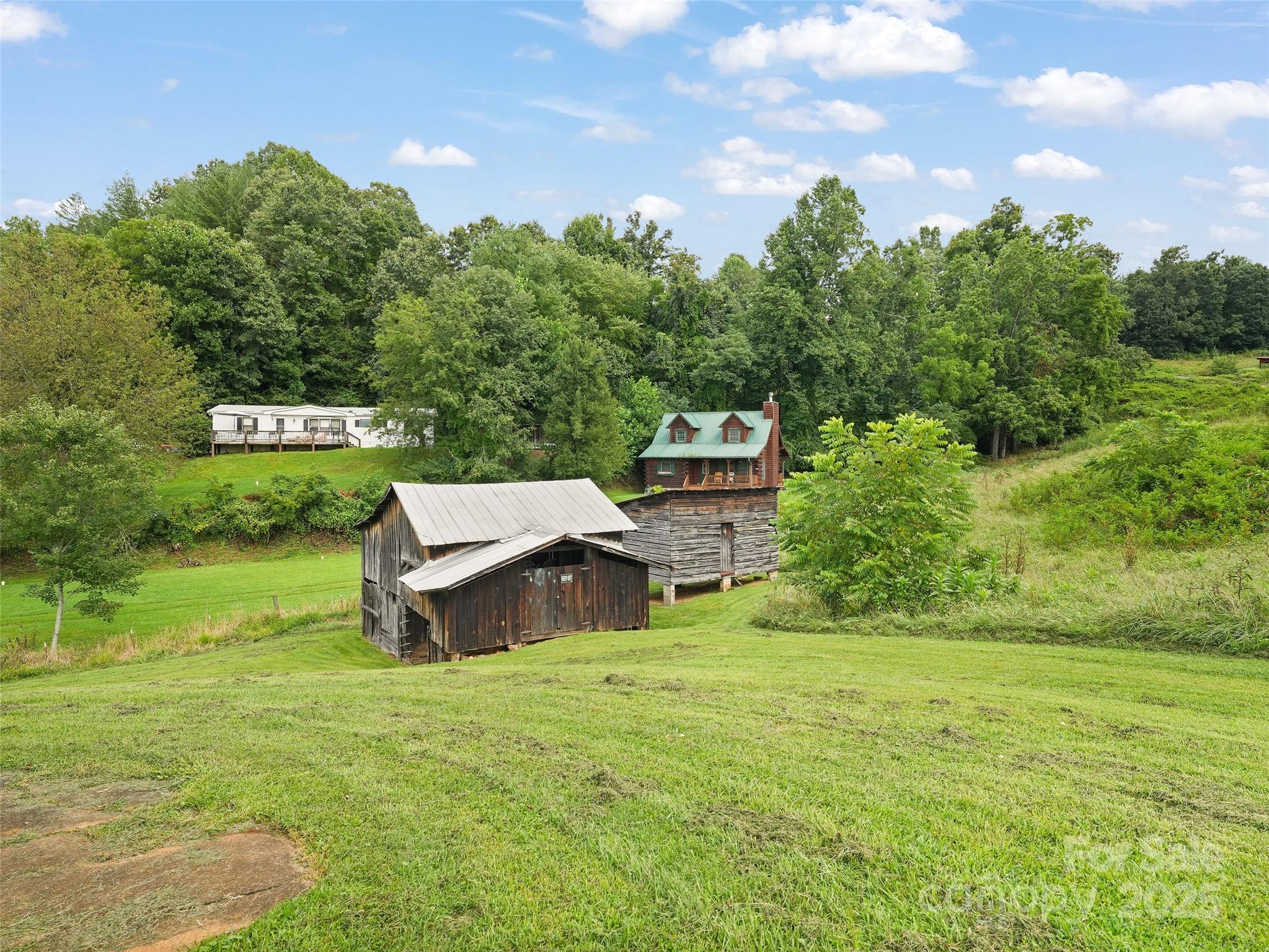 5 Noland Downs Road Waynesville, NC 28785 - Photo 29 of 33 a view of a garden with a house