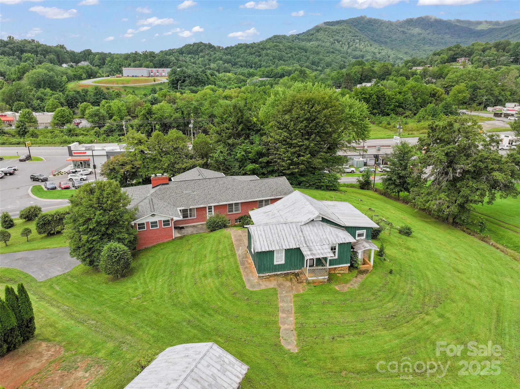 5 Noland Downs Road Waynesville, NC 28785 - Photo 30 of 33 an aerial view of a house with yard and green space