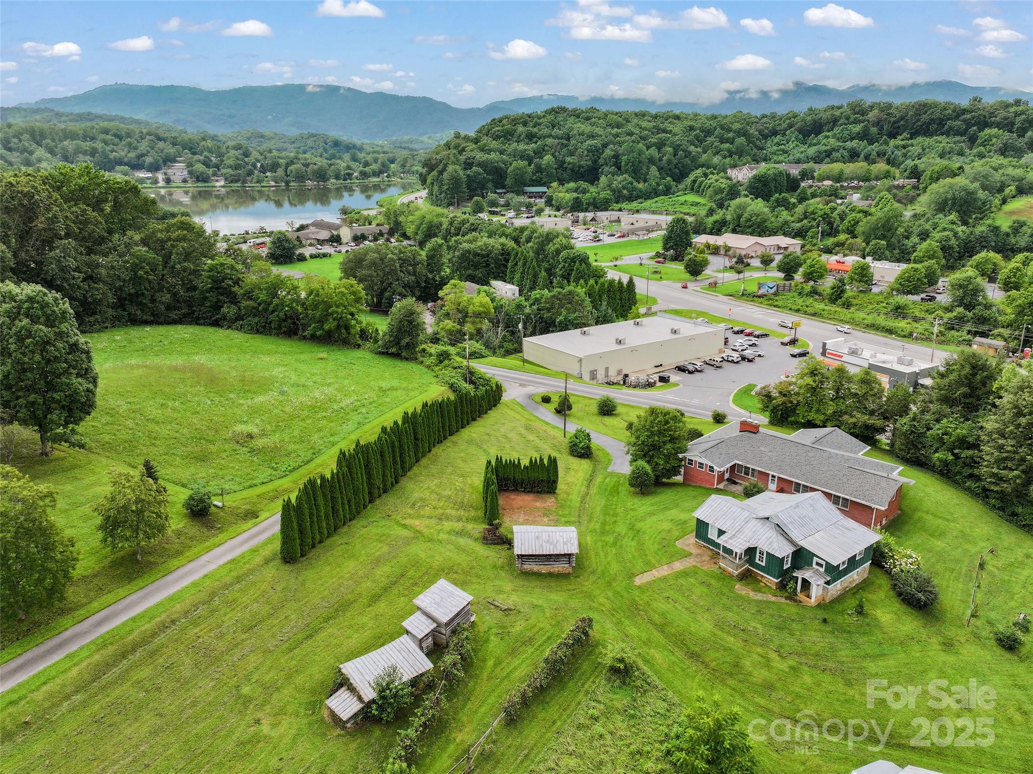 5 Noland Downs Road Waynesville, NC 28785 - Photo 32 of 33 an aerial view of a house with a garden