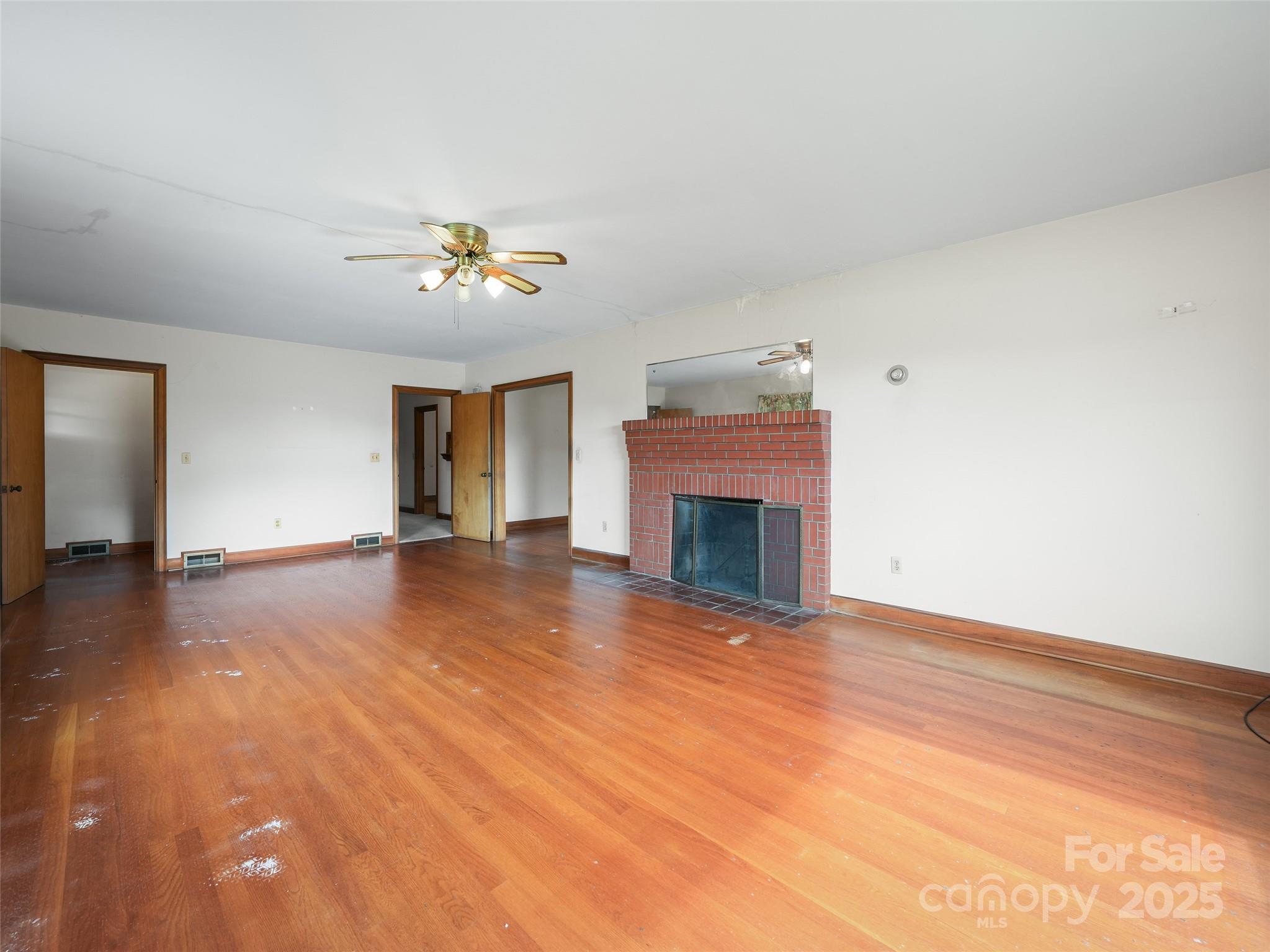 5 Noland Downs Road Waynesville, NC 28785 - Photo 8 of 33 a view of an empty room with a fireplace