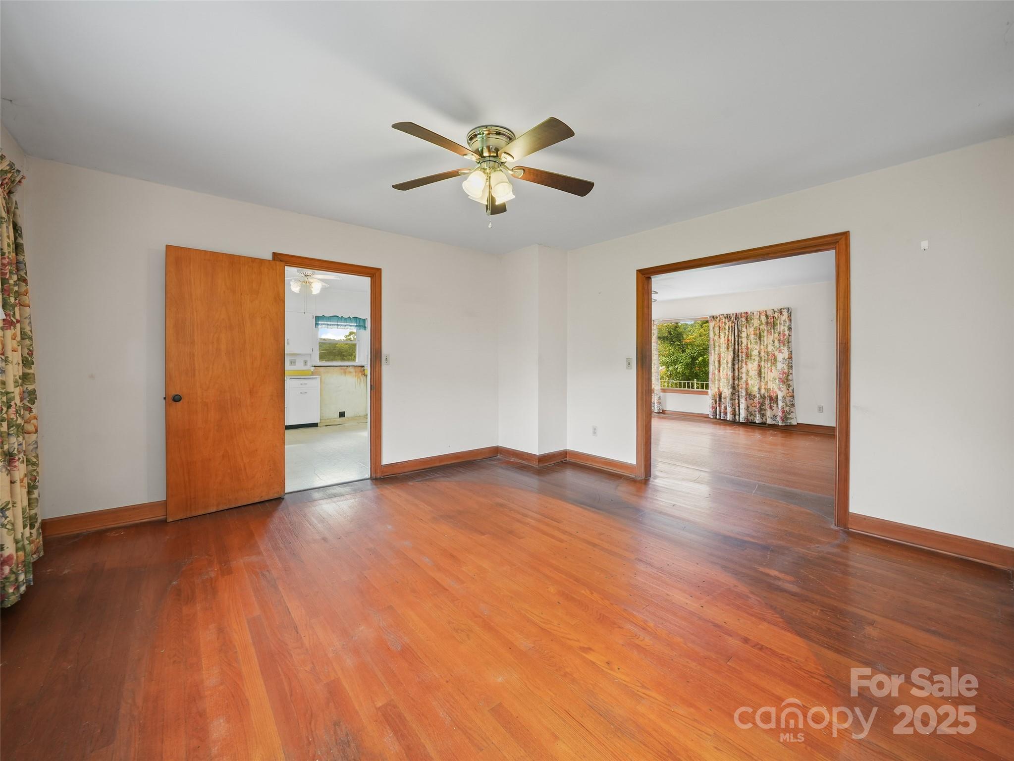 5 Noland Downs Road Waynesville, NC 28785 - Photo 9 of 33 a view of an empty room with window and wooden floor