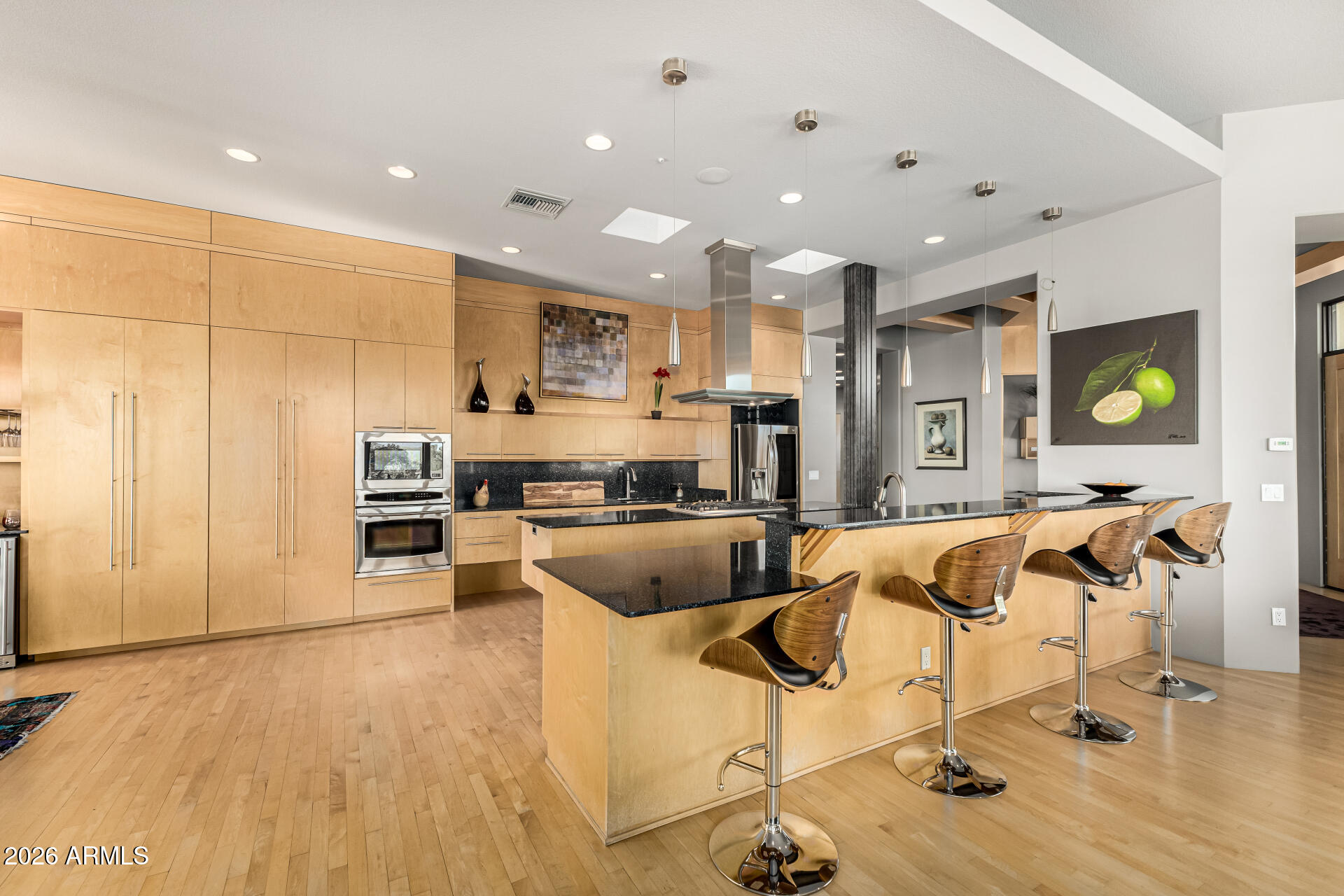 18567 East Paseo Verde Drive Rio Verde, AZ 85263 - Photo 12 of 47 a kitchen with stainless steel appliances kitchen island granite countertop a refrigerator and a stove top oven