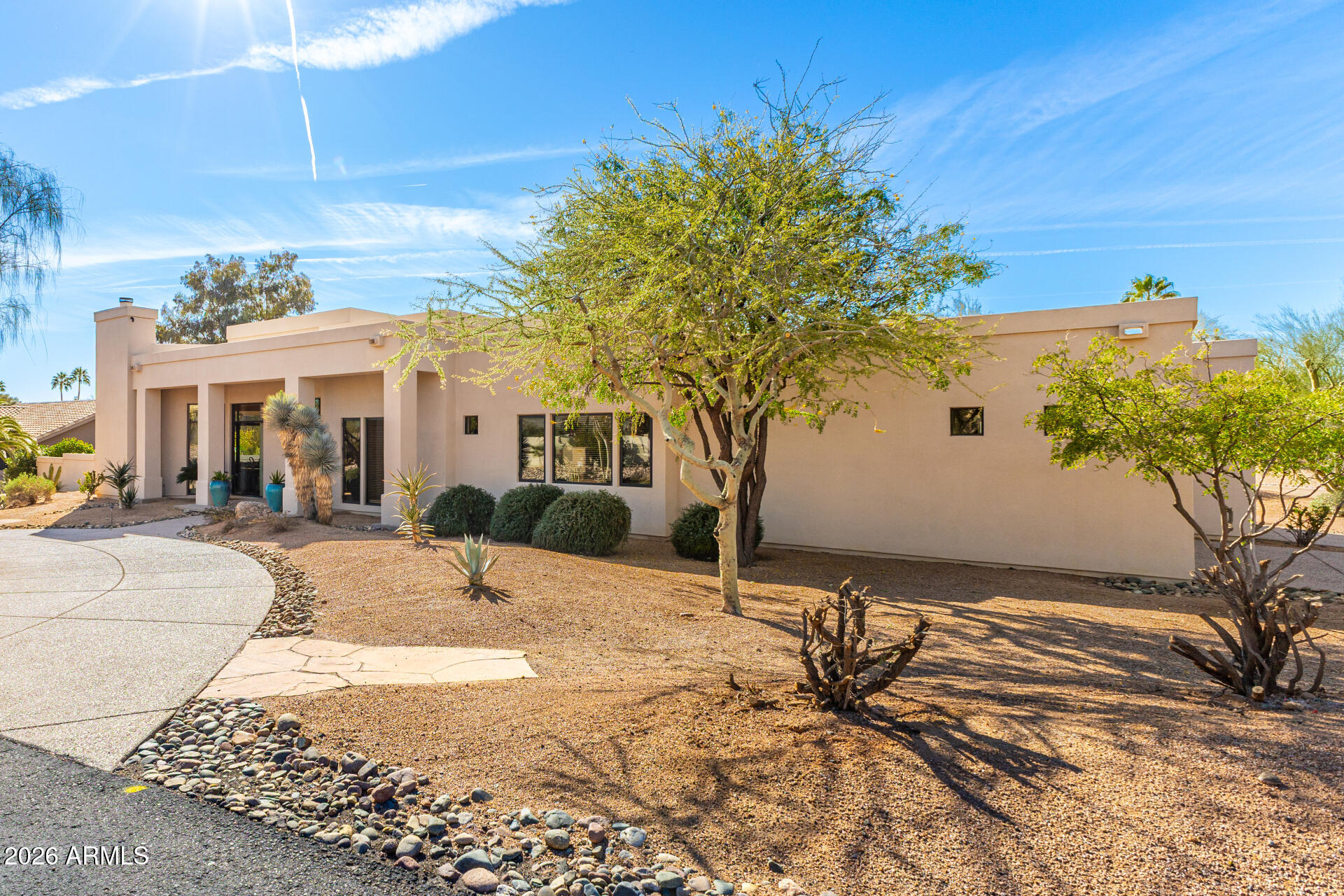 18567 East Paseo Verde Drive Rio Verde, AZ 85263 - Photo 2 of 47 a view of a backyard with a tree