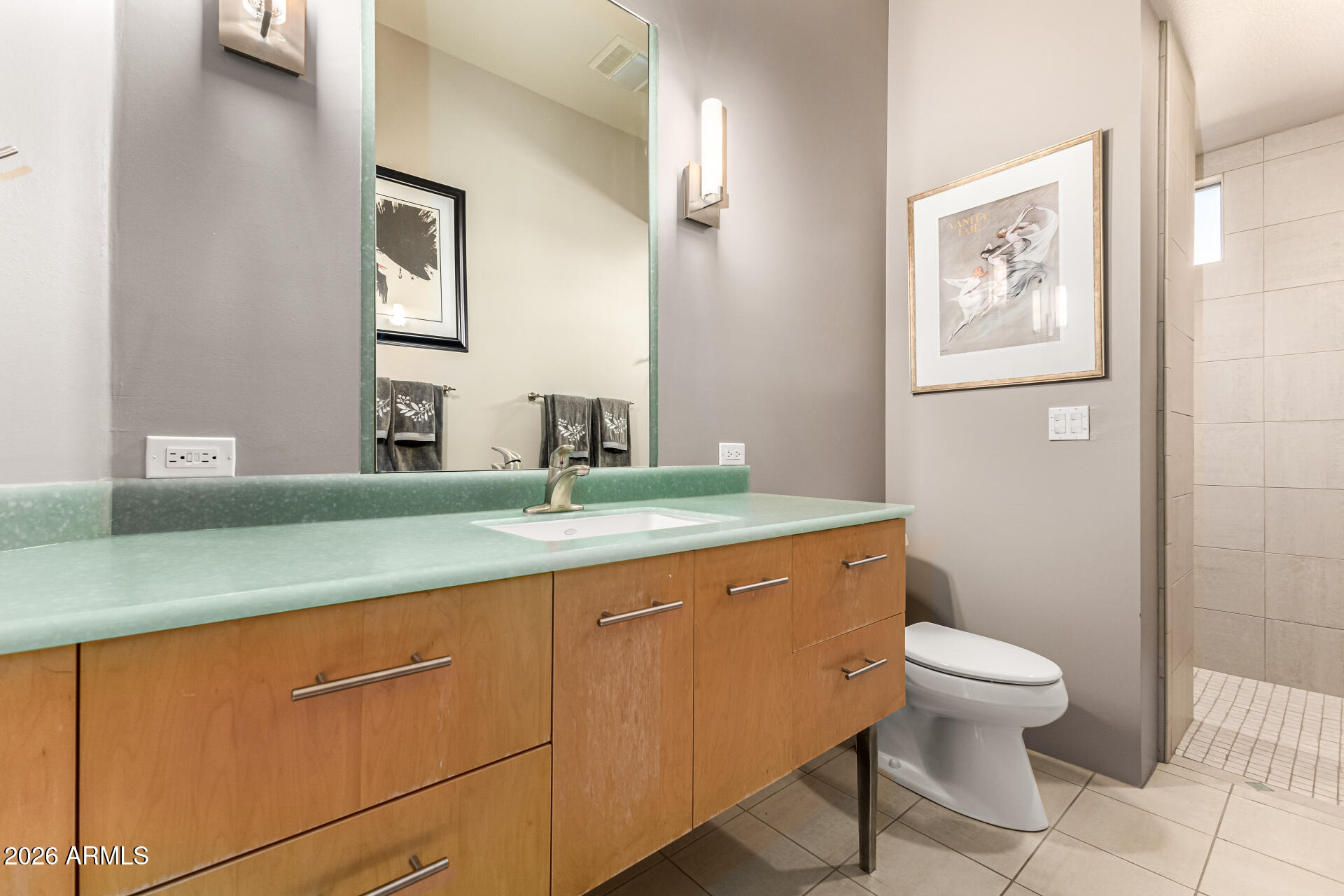 18567 East Paseo Verde Drive Rio Verde, AZ 85263 - Photo 27 of 47 a bathroom with a toilet sink and mirror