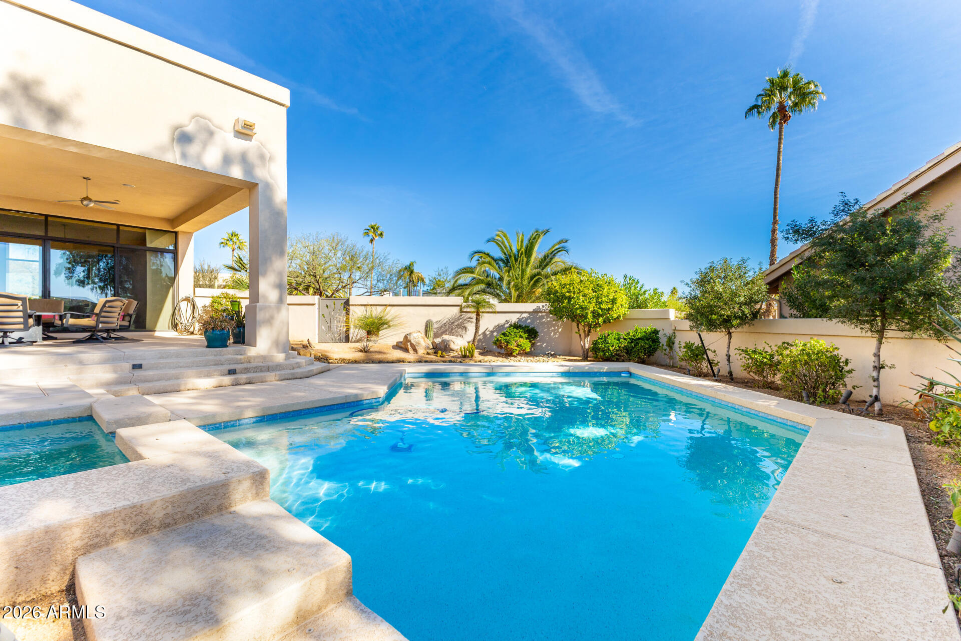 18567 East Paseo Verde Drive Rio Verde, AZ 85263 - Photo 33 of 47 a view of a swimming pool with a patio