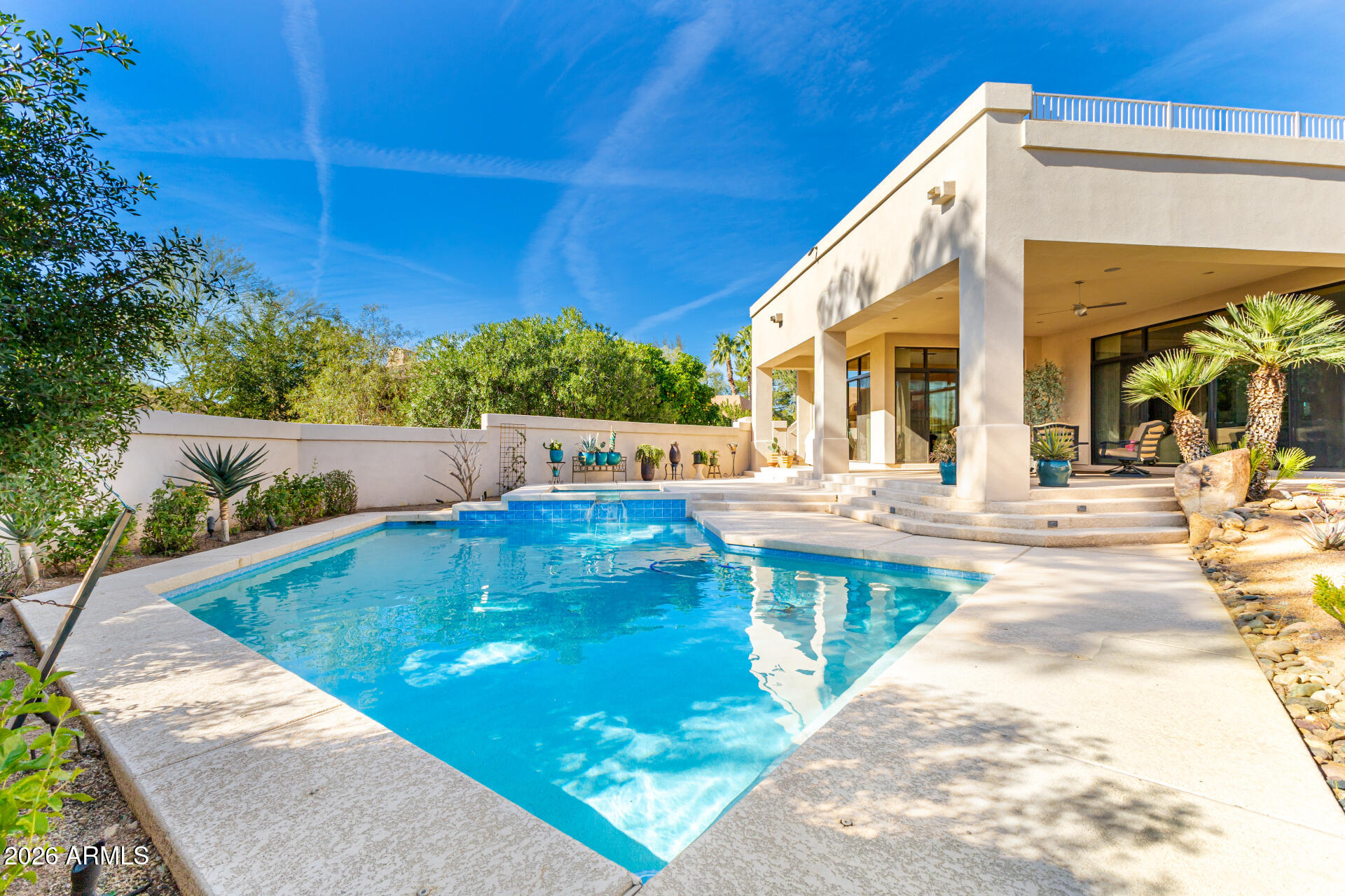 18567 East Paseo Verde Drive Rio Verde, AZ 85263 - Photo 35 of 47 a view of a swimming pool with a patio