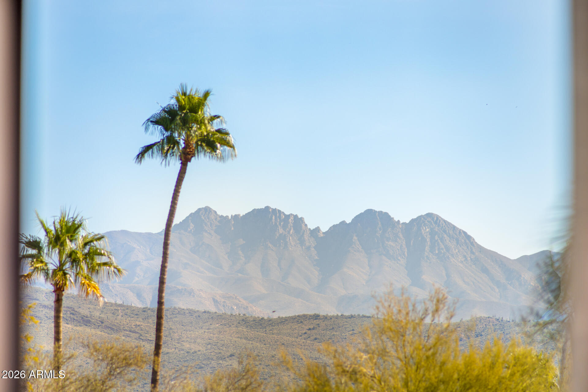 18567 East Paseo Verde Drive Rio Verde, AZ 85263 - Photo 37 of 47 a view of a lake with a mountain in the background