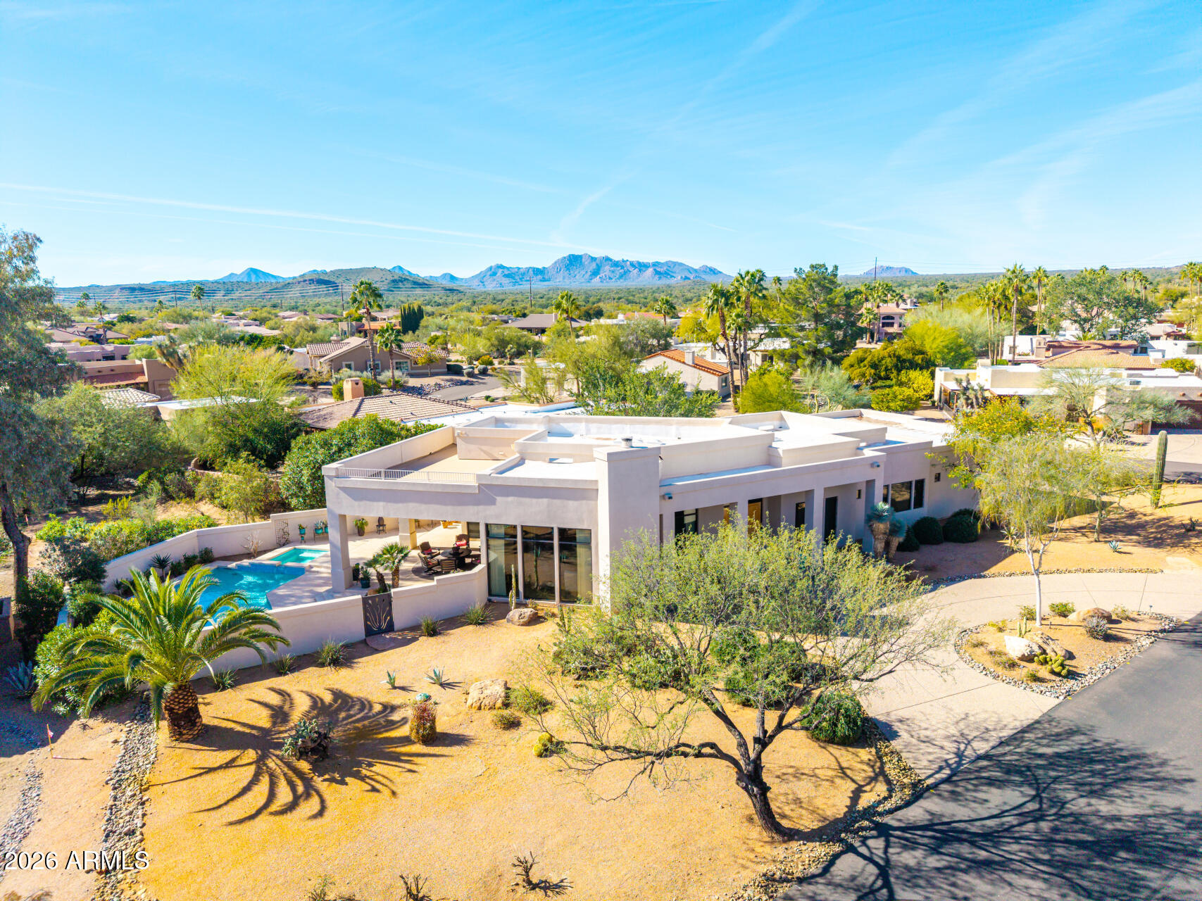 18567 East Paseo Verde Drive Rio Verde, AZ 85263 - Photo 43 of 47 a view of a swimming pool with a table and chairs