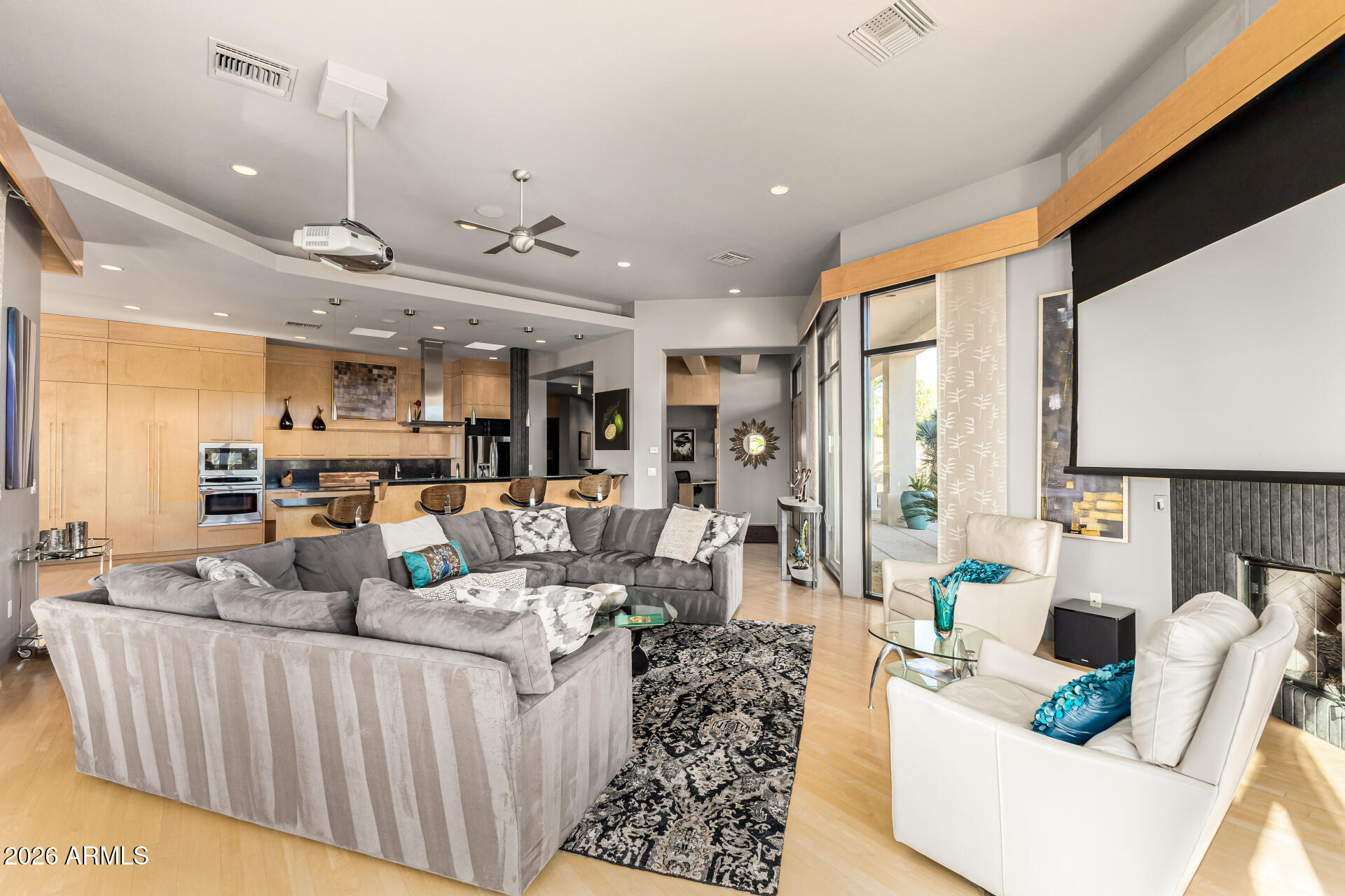 18567 East Paseo Verde Drive Rio Verde, AZ 85263 - Photo 9 of 47 a living room with furniture and a flat screen tv