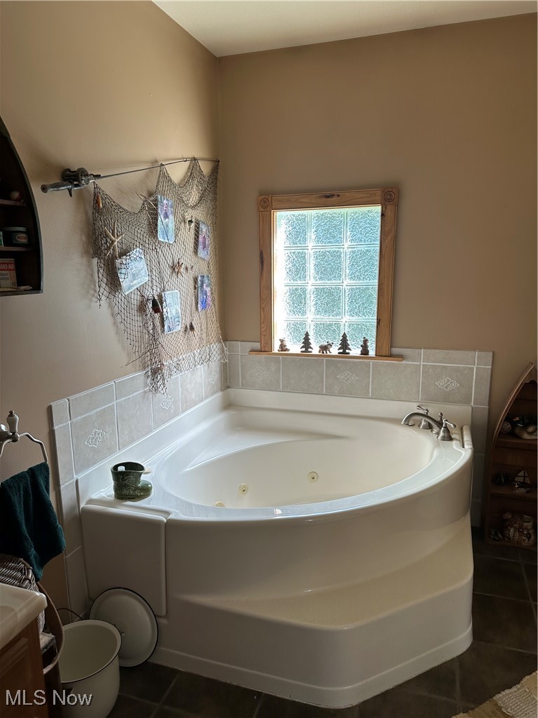 48864 Dry Ridge Road Clarington, OH 43915 - Photo 23 of 49 Full bath featuring a whirlpool tub and tile patterned flooring