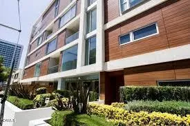 a view of a building with a yard