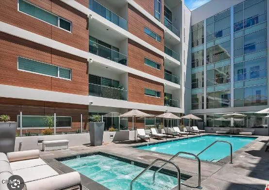 a table and chairs in front of a building