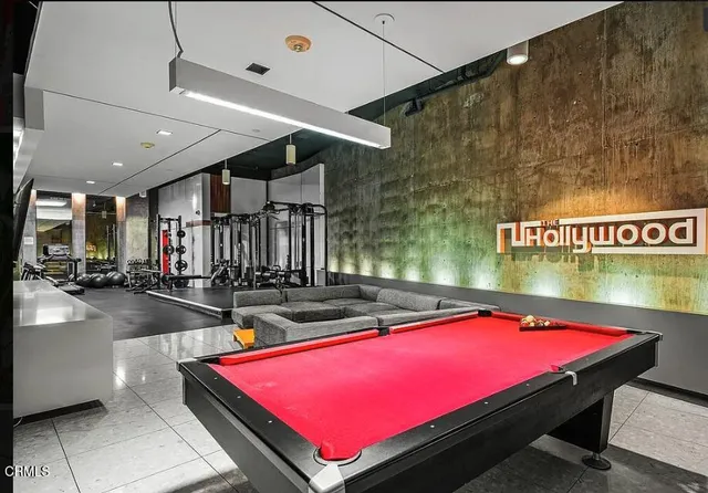 a room with pool table and pool table