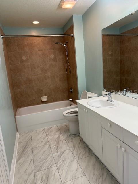 5123 Melbourne Street, Unit D104 Punta Gorda, FL 33980 - Photo 1 of 1 a bathroom with a double vanity sink toilet and shower
