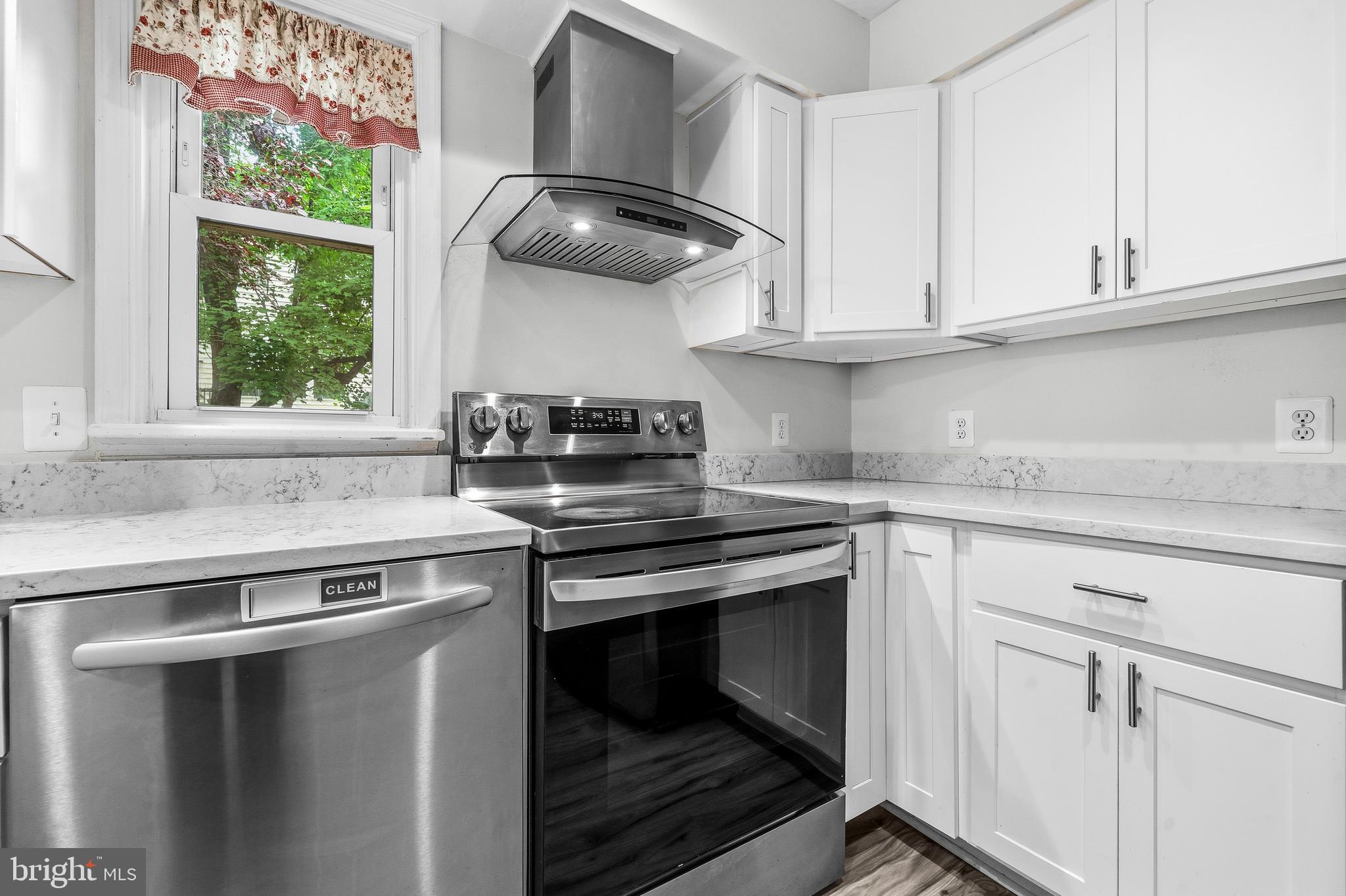 6001 Rabbit Hill Court Centreville, VA 20121 - Photo 16 of 46 a kitchen with stainless steel appliances granite countertop a sink and a stove