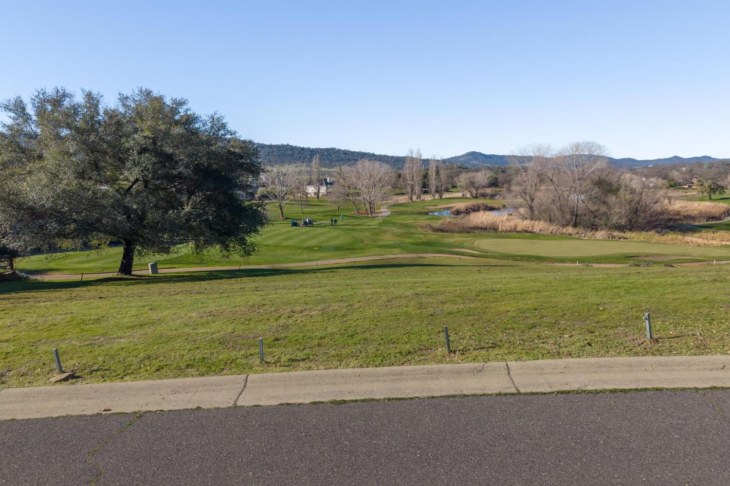 767 Grinding Rock Road Angels Camp, CA 95222 - Photo 5 of 13 a view of a golf course with a lake