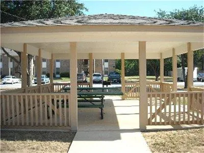 a view of a swimming pool and outdoor seating