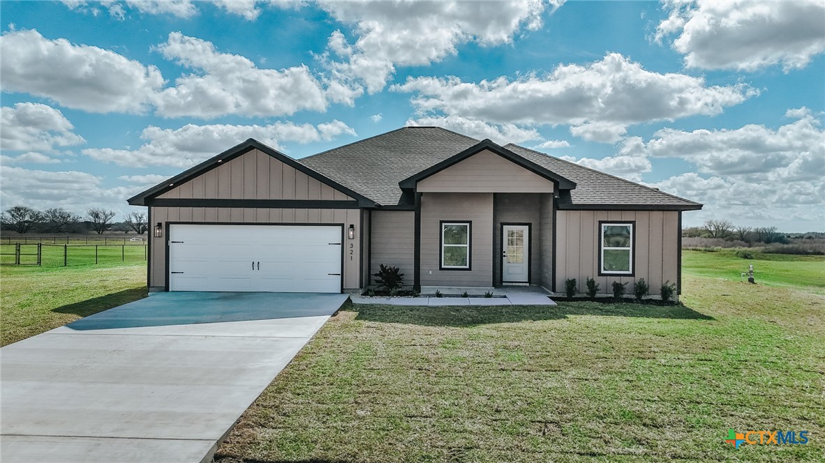 321 Whitetail Lane Victoria, TX 77905 - Photo 2 of 47 a front view of a house with a yard