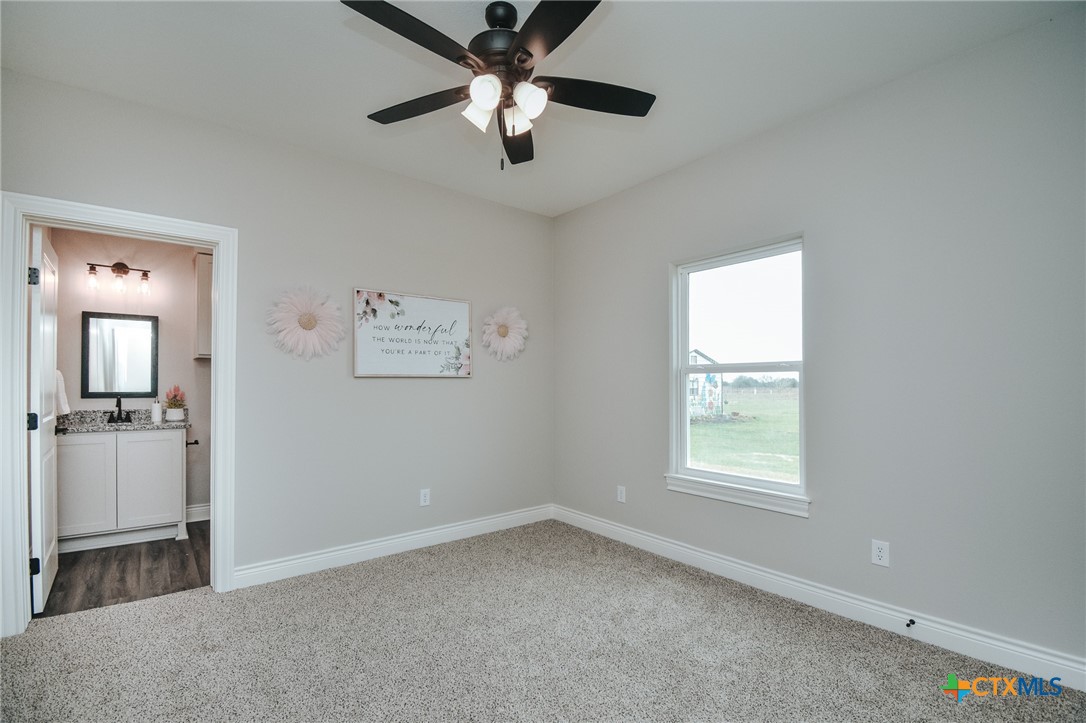 321 Whitetail Lane Victoria, TX 77905 - Photo 28 of 47 wooden floor in an empty room with a window